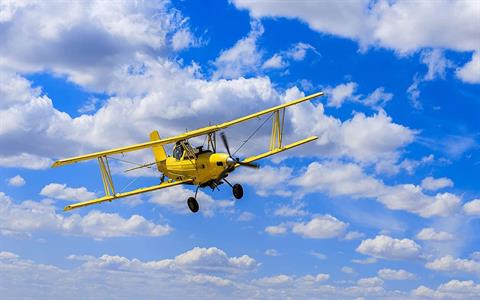FOTOMURALE INTO ADVENTURE BIPLANE MIS.400X250 CM